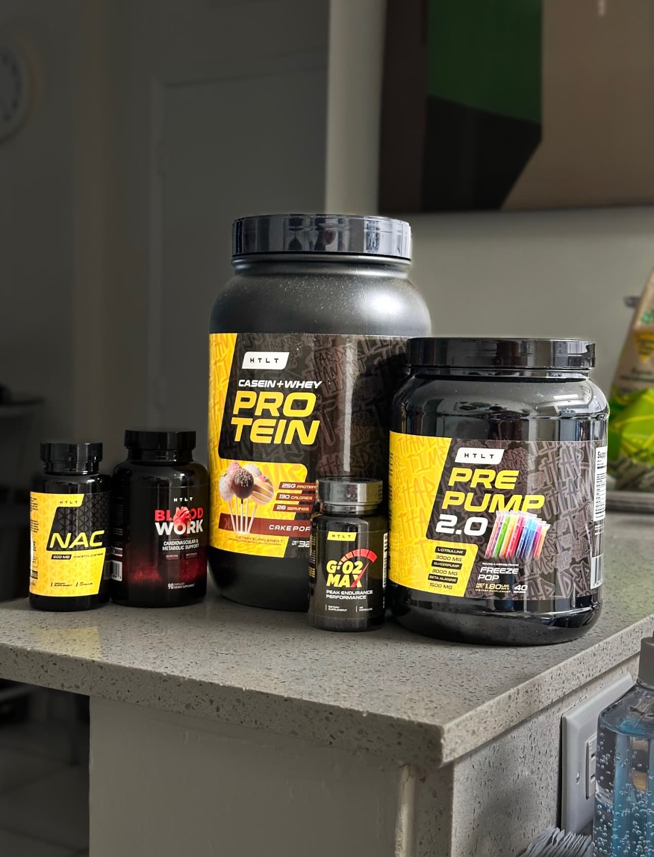 HTLT supplement stack on kitchen counter